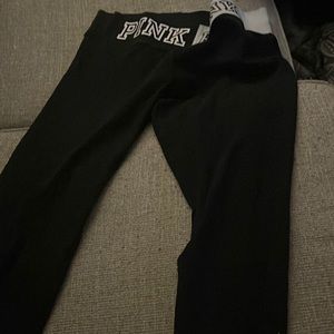 Black leggings with designs from the store pink